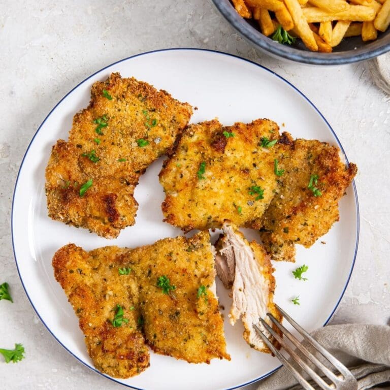 Recipes for Air Fryer Chicken Thighs a Plate of Crispy Chicken Thighs with a Bowl of French Fries