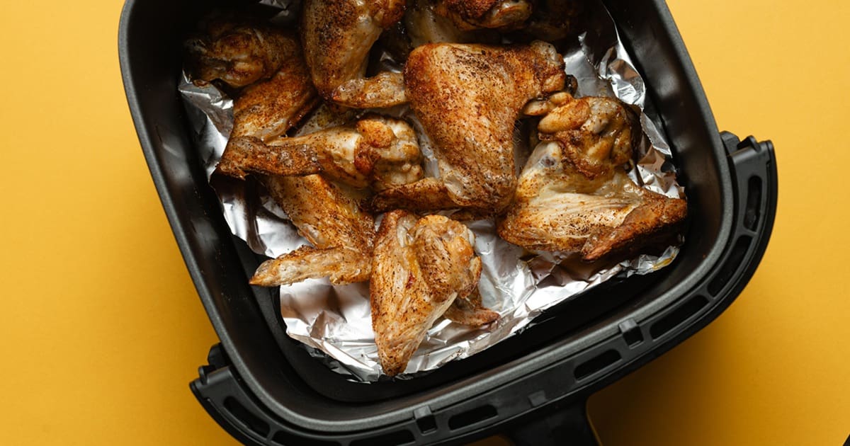 Easy Air Fryer Buffalo Wings Cooked Chicken Wings in an Air Fryer Basket