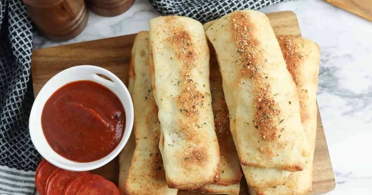 Easy Appetizers a Serving Tray of Air Fryer Cheesy Pepperoni Breadsticks with Marinara