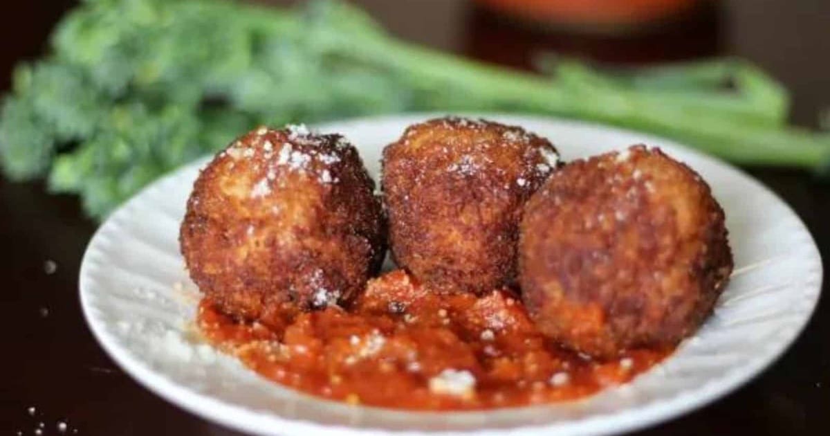 Easy Appetizers a Plate of Arancini with Marinara and Broccolini