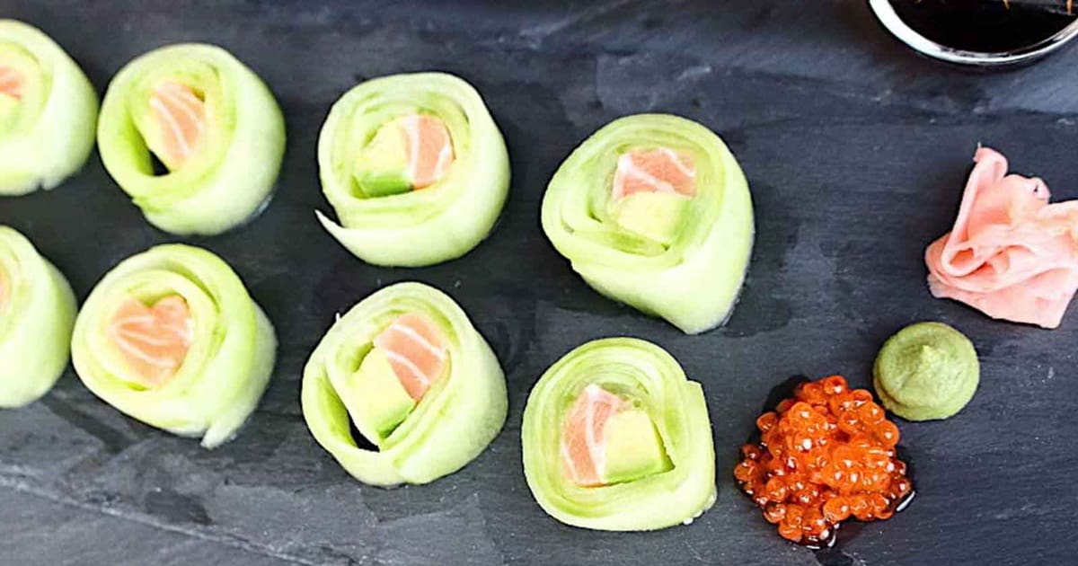 Easy Appetizers Close Up of a Cutting Board with Cucumber Sushi Rolls