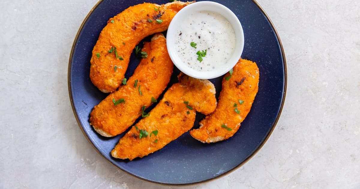 Christmas Party Air Fryer Recipes Easy Air Fryer Buffalo Chicken Tenders on a Plate with a Small Bowl of Ranch Dressing