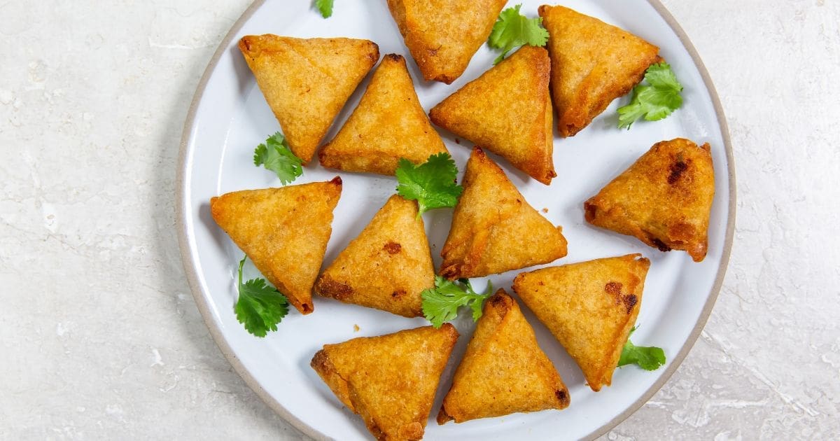 New Year's Eve Air Fryer Party Recipes Overhead of a Plate of Air Fryer Mini Chicken Tikka Samosas