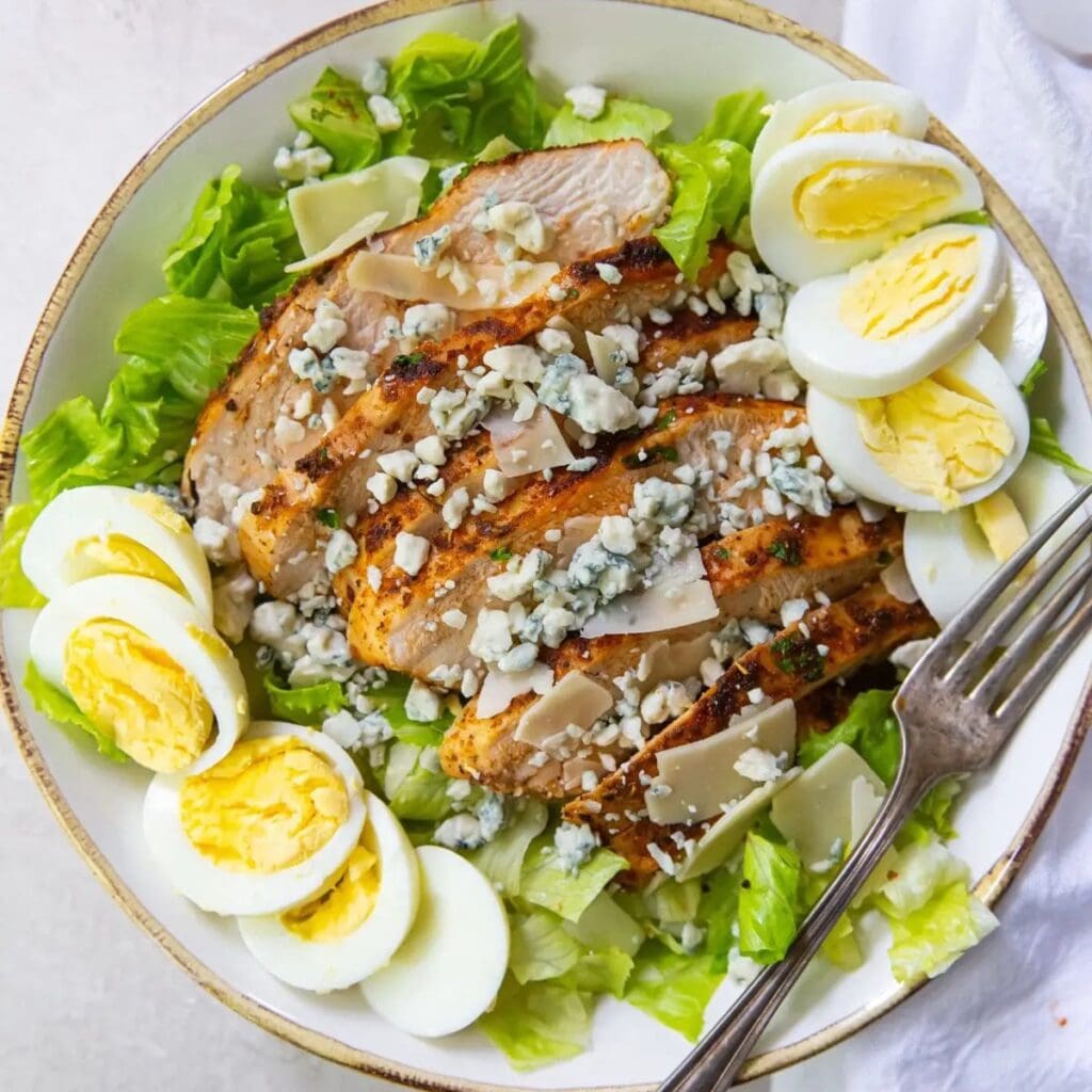 Healthy Air Fryer Recipes with Chicken Breast a Bowl of Salad Topped with Blackened Chicken and Hard Boiled Eggs