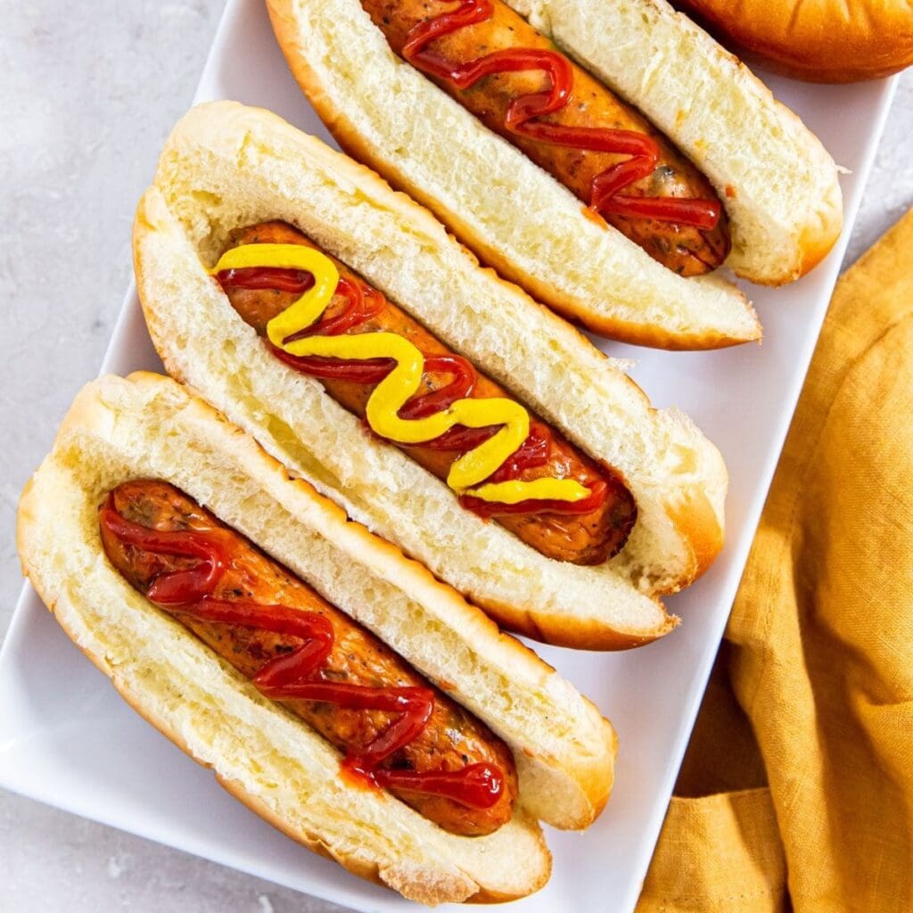 Kids Valentine's Dinner Recipes a Platter of Chicken Hot Dogs in Buns with Ketchup and Mustard on Them Alternatively