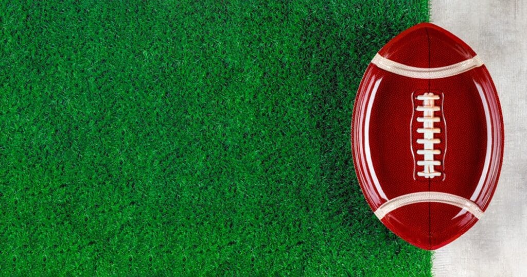 Super Bowl Air Fryer Recipes A Football-Shaped Serving Platter on a Green Field