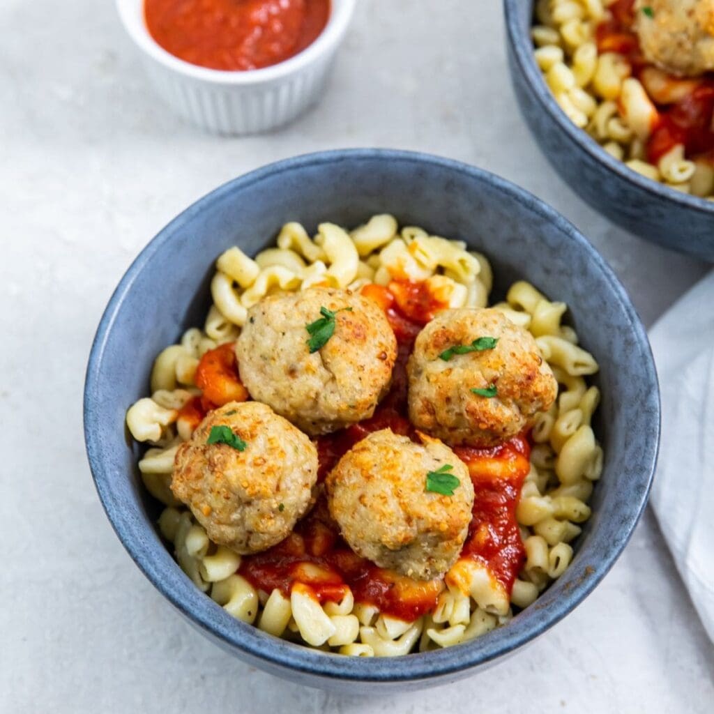 Air Fryer Addict Recipes a Bowl of Pasta with Marinara Sauce and Chicken Meatballs