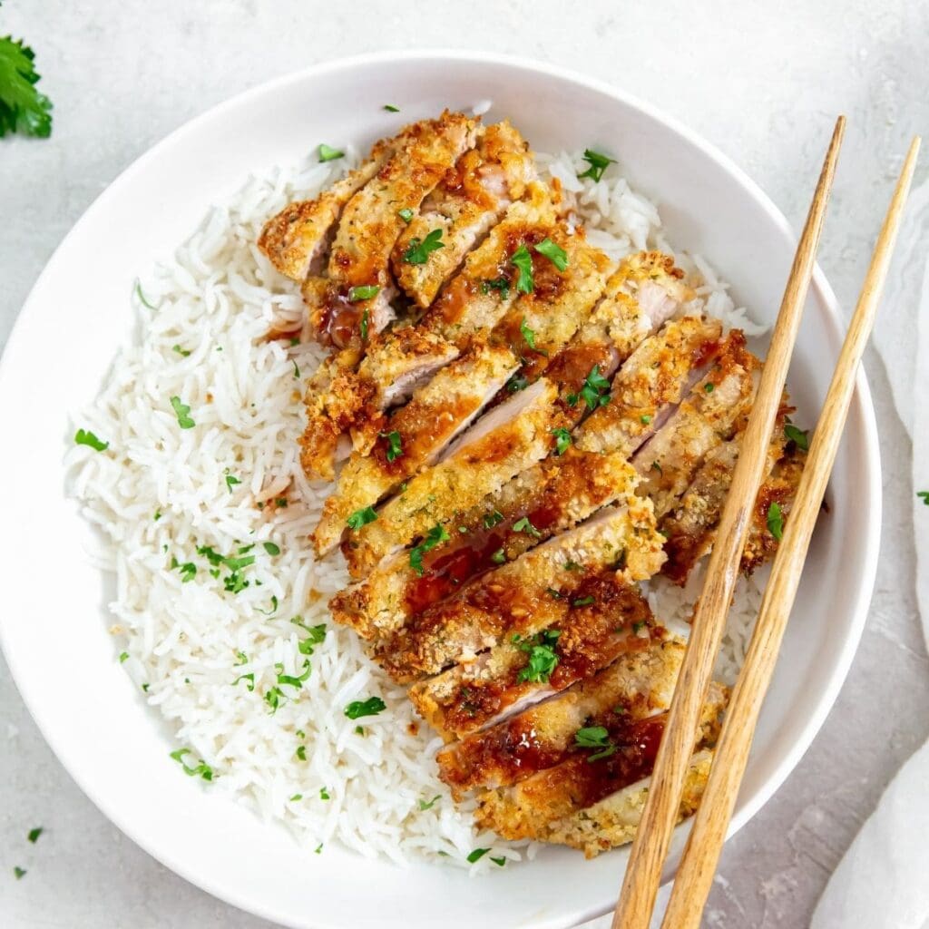 Chicken Air Fryer Recipes That Are Pure Protein Power a Bowl of Rice Topped with Katsu Sauce