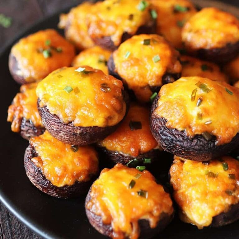 Air Fryer Side Dishes for Chicken Recipes Close Up of Cheesy Stuffed Mushrooms on a Serving Platter