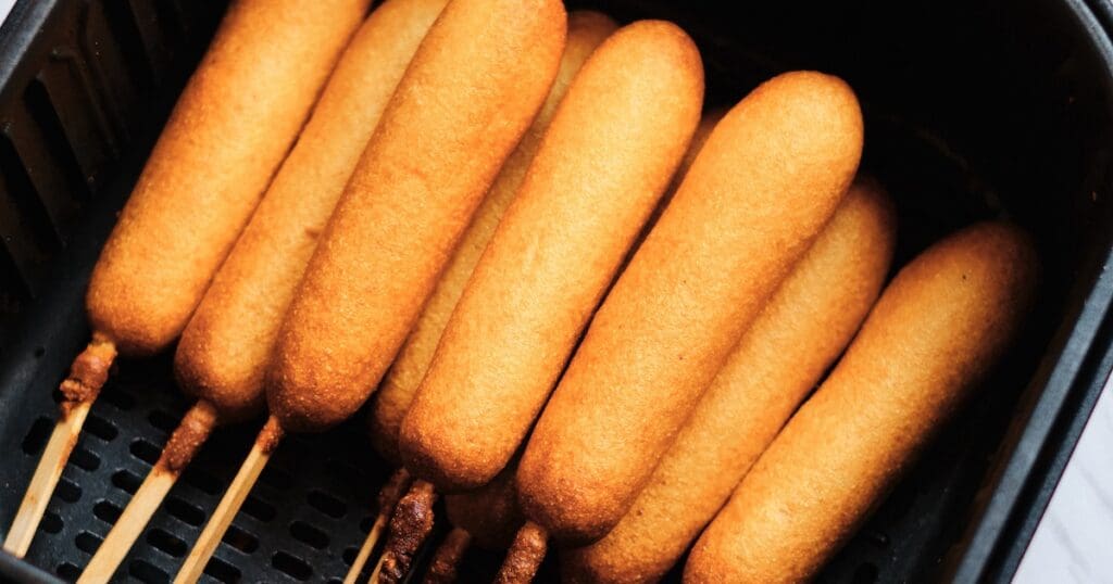 July 4th Air Fryer Recipes Frozen Corn Dogs in an Air Fryer Basket