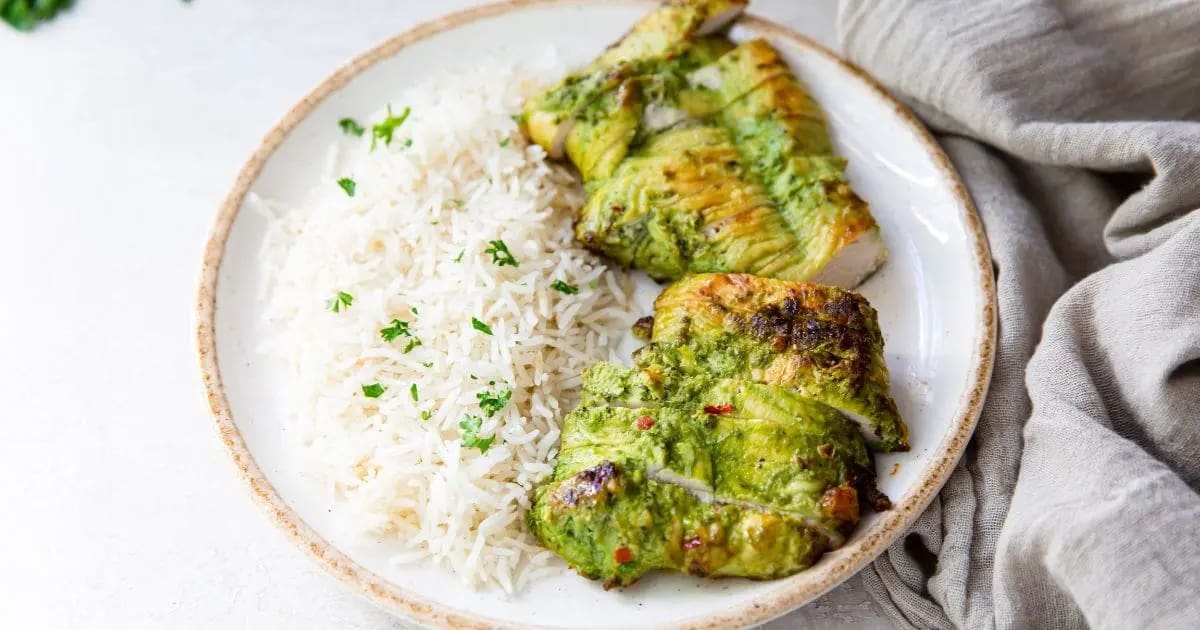 Delicious Chicken Air Fryer Recipes For Busy Weeknights a Plate of Trader Joe's Pesto Chicken in the Air Fryer with Rice