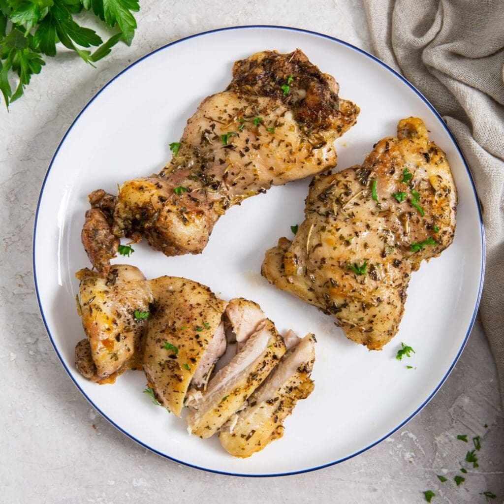 30 Flavorful Chicken Air Fryer Recipes That Prove 'Em Wrong a Plate of Cooked Boneless Skinless Chicken Thighs