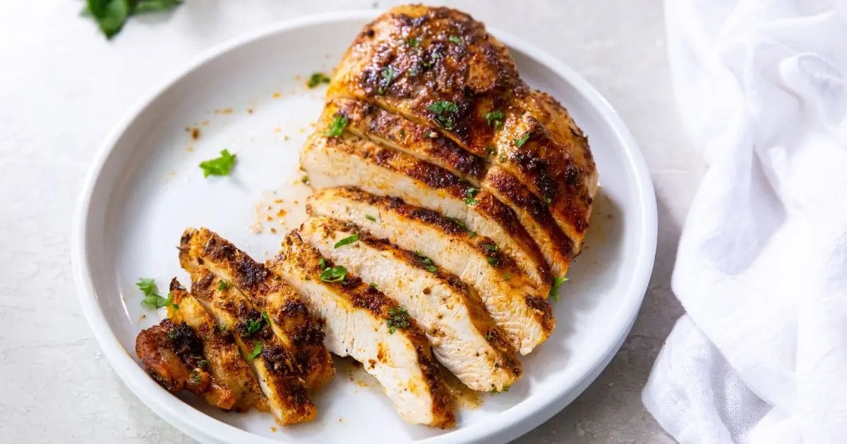 Air Fryer Chicken Recipes That Top Grandma’s Classics Half Sliced Air Fryer Blackened Chicken Breast on a Plate