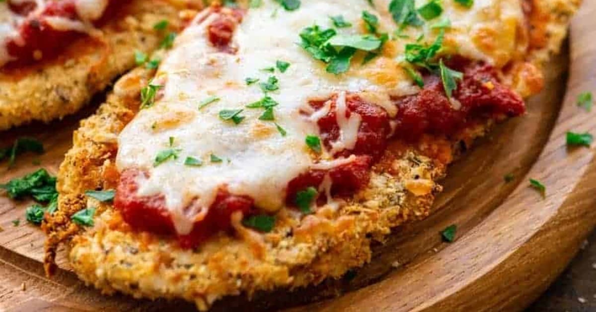 Air Fryer Parmesan Crusted Chicken Breast Recipes Close Up of Air Fryer Chicken Parmesan on a Wooden Plate