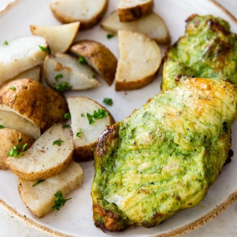 Tasty Chicken Recipes Close Up of Pesto Chicken on a Plate with Roasted Potatoes