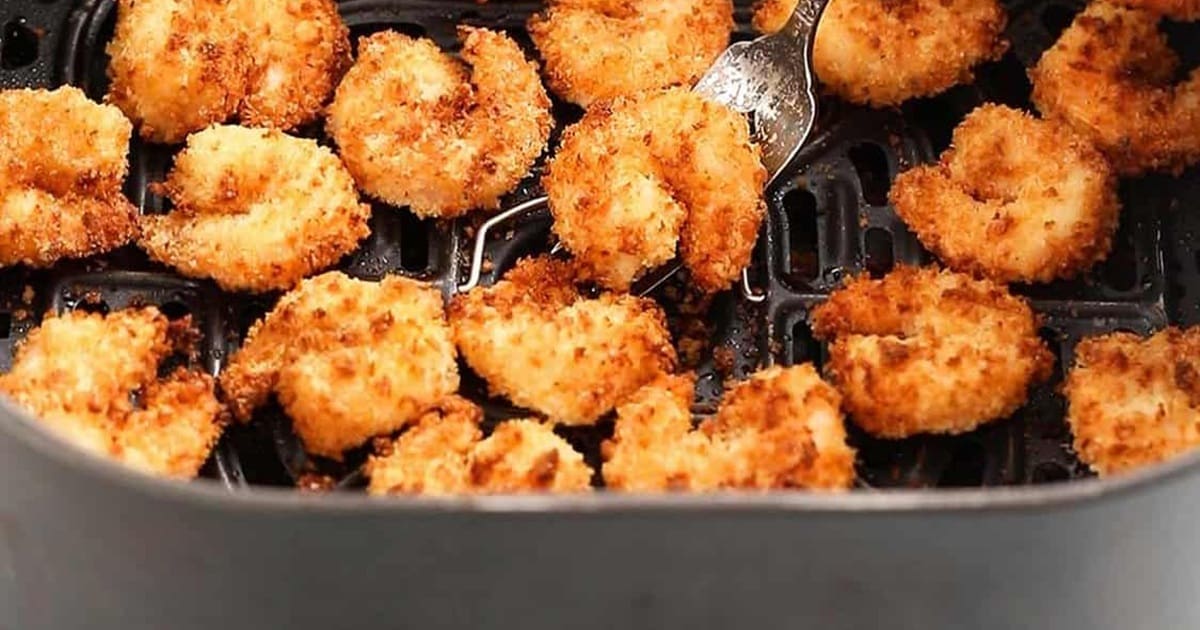 Quick Super Bowl Air Fryer Recipes Close Up of Air Fryer Breaded Shrimp in an Air Fryer Basket