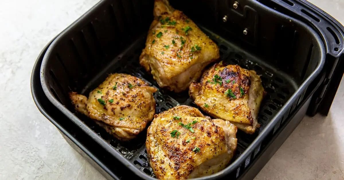 Chicken Air Fryer Recipes That'll Make Your Family Go Bananas Air Fryer Lemon Pepper Chicken Thighs in an Air Fryer Basket
