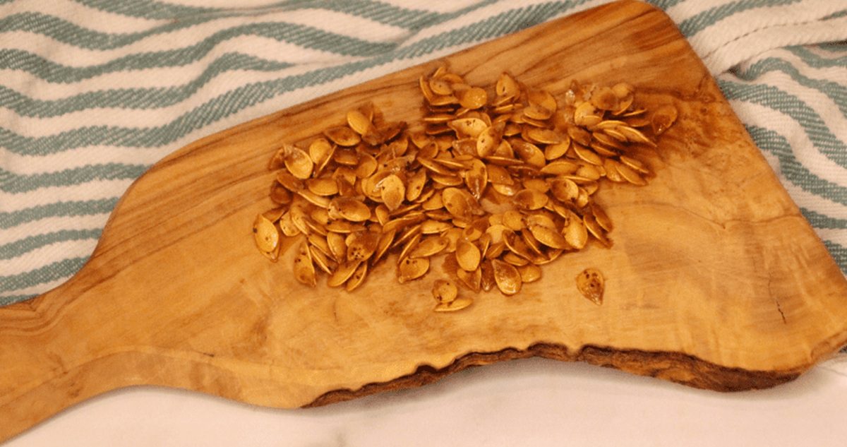 Acorn Squash Air Fryer Recipes Air Fryer Roasted Acorn Squash Seeds on a Wooden Serving Board