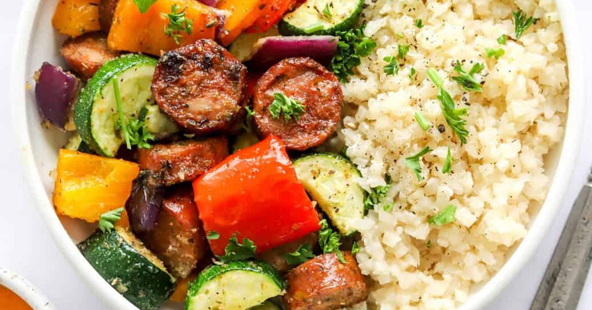 Must-Try Chicken Air Fryer Recipes for Stress-Free Meals Close Up of Air Fryer Chicken Sausage and Veggies in a Bowl with Rice
