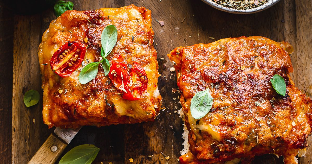 Air Fryer Christmas Party Appetizer Recipes Two Slices of Air Fryer Focaccia Pizza on a Cutting Board