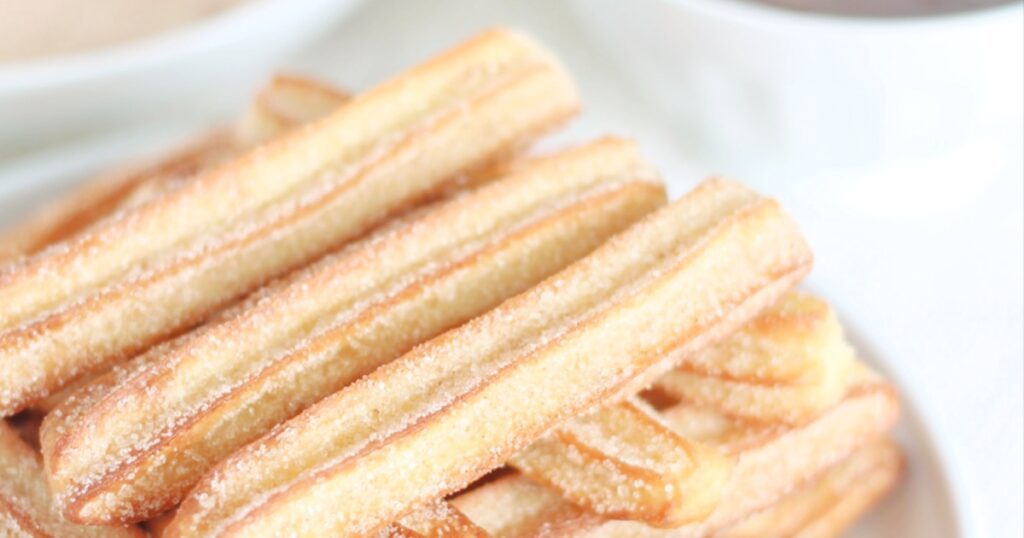 Air Fryer Christmas Party Recipes Close Up of a Plate Filled with Air Fryer Churros
