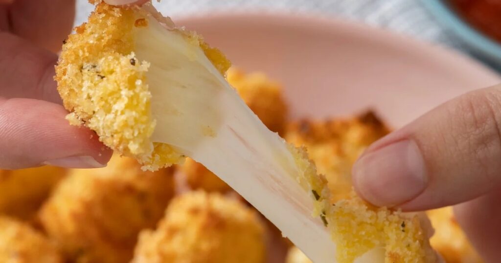Air Fryer Christmas Party Recipes Air Fryer Crispy Cheese Bites Being Pulled Apart by a Person's Hands