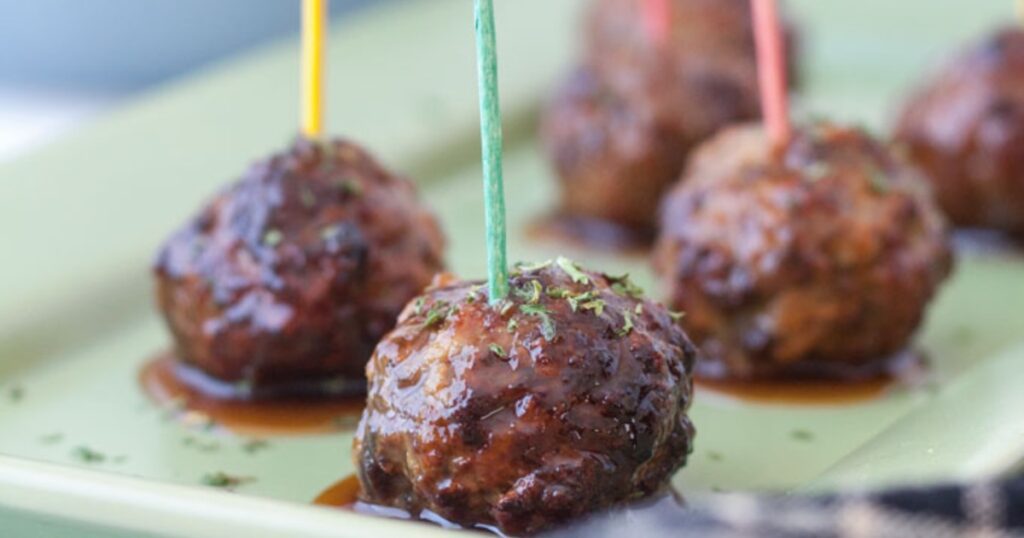 Air Fryer Christmas Party Recipes Close Up of Air Fryer Meatballs with Toothpicks Sticking in Them