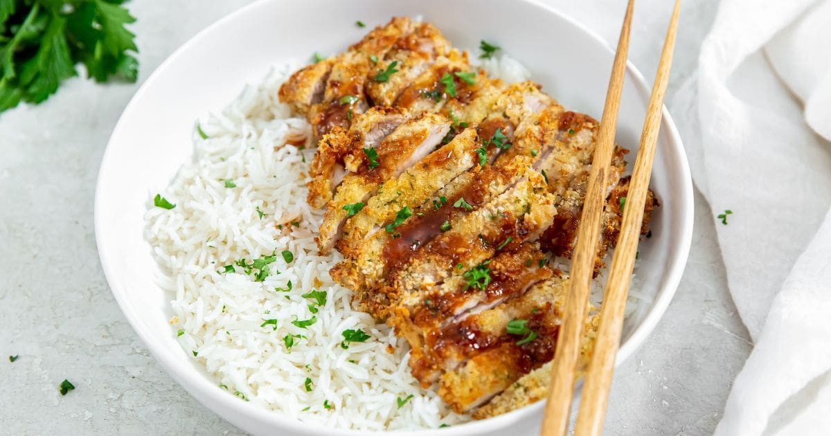 Best Chicken Recipes That Will Have Your Family Begging For More Air Fryer Katsu Chicken Thighs Sliced on Rice in a Bowl