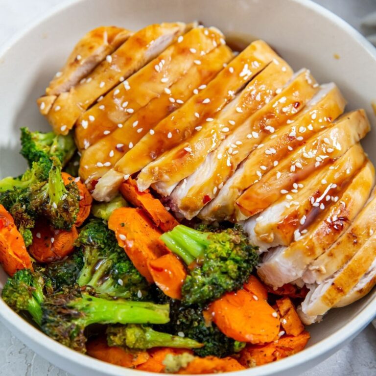 Easy Chicken Air Fryer Recipes Ready in 30 Minutes Close Up of Sliced Teriyaki Chicken on Rice with Steamed Veggies in a Bowl