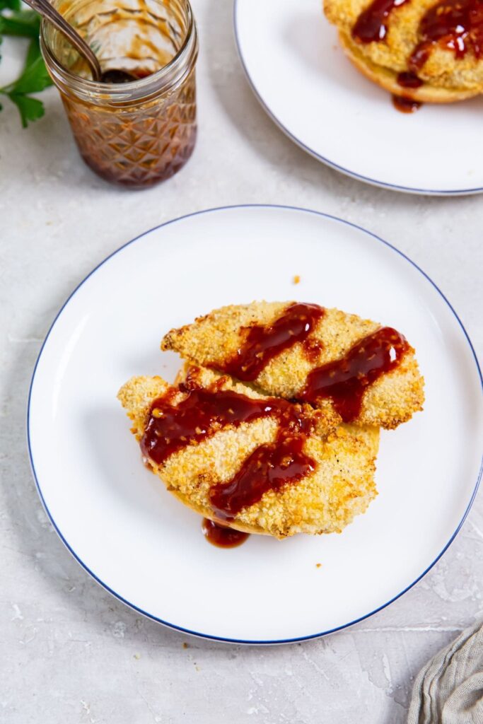 Air Fryer Katsu Chicken Sandwich Breaded Chicken Strips Drizzled with Katsu Sauce on Plates