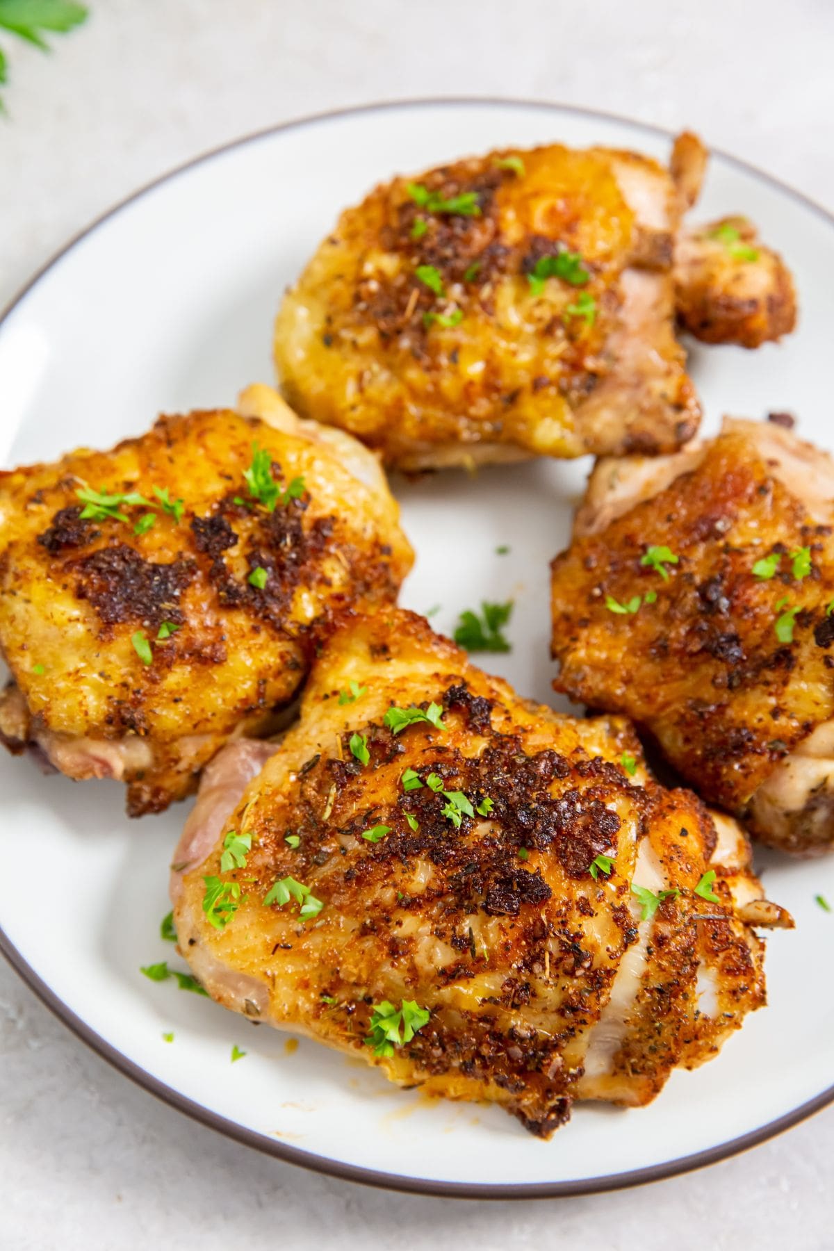 Air Fryer Keto Chicken Thighs on a White Plate