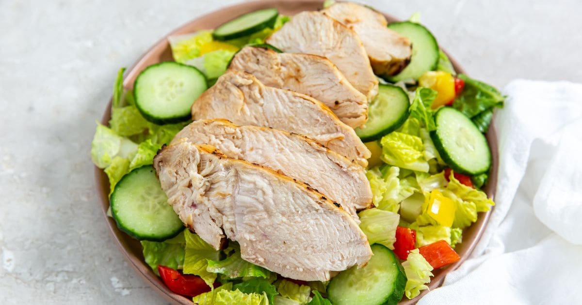 Quick Chicken Air Fryer Recipes Sliced Air Fryer Italian Chicken Breast on a Salad in a Bowl