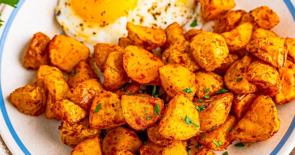 Air Fryer Easter Brunch Recipes Close Up of Air Fryer Home Fries on a Plate with Over Easy Eggs