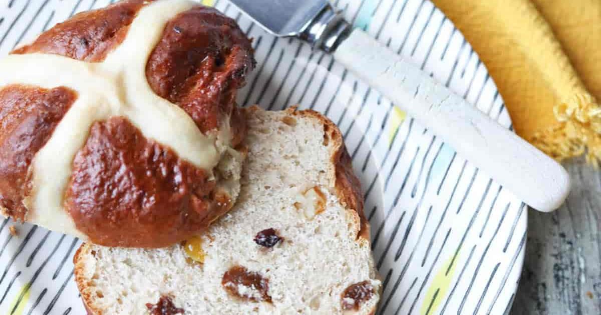 Air Fryer Easter Brunch Recipes Close Up of a Air Fryer Hot Cross Bun Cut in Half Length Wise on a Plate