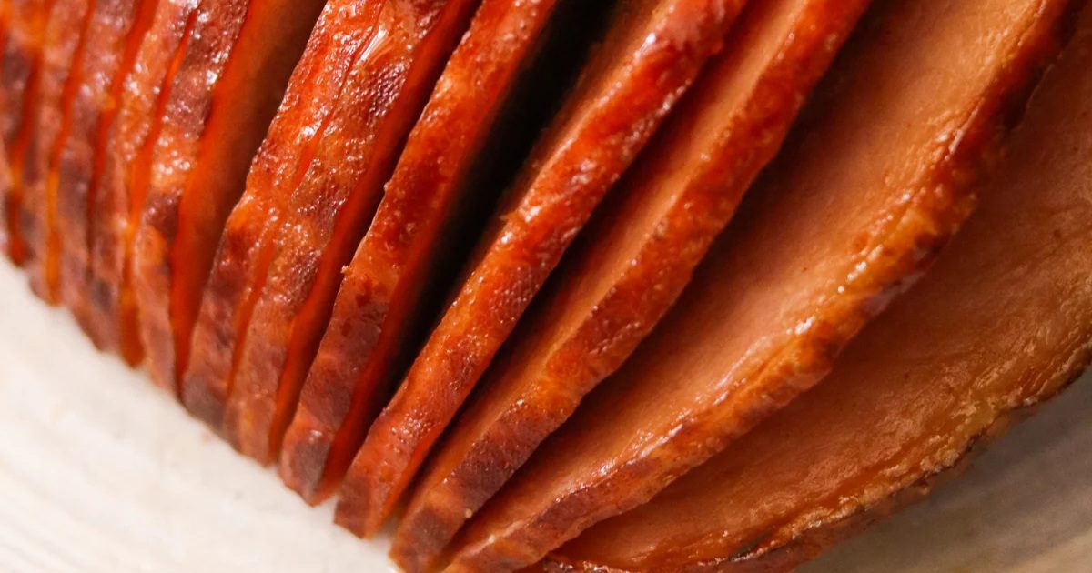 Air Fryer Easter Dinner Recipes Close Up of Sliced Air Fryer Ham with Homemade Honey Glaze on a Plate
