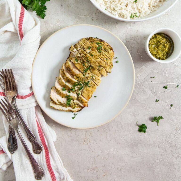 Easter Air Fryer Chicken Recipes a Plate of Sliced Pesto Chicken Breast Next to a Small Ramekin of Pesto Sauce