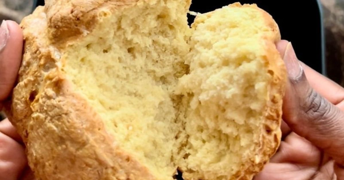 St. Patrick's Day Air Fryer Recipes Close Up of a Person's Hands Pulling Apart Homemade Irish Soda Bread