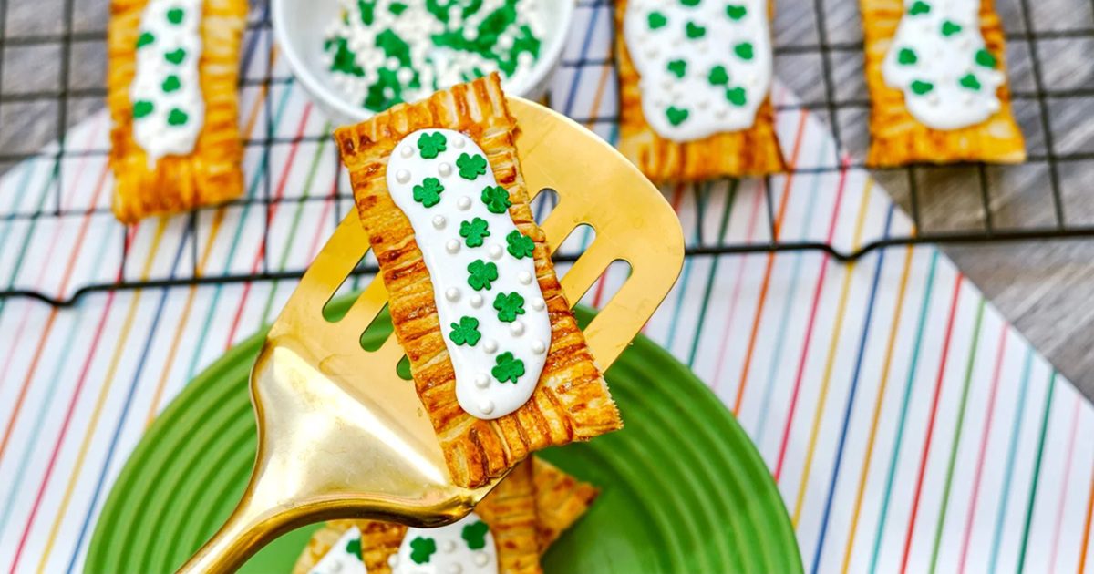 St. Patrick's Day Air Fryer Recipes St.Patrick&rsquo;s Pop-Tarts Breakfast Pastry on a Golden Spatula Hovering Above More on a Cooling Rack