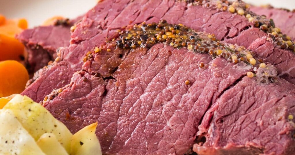 St. Patrick's Day Air Fryer Recipes Close Up of Air Fryer Corned Beef on a Plate with Cabbage and Carrots