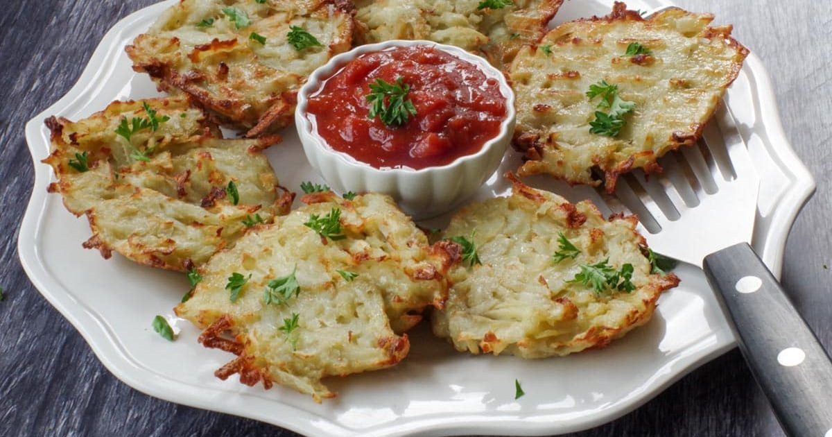 St. Patrick's Day Air Fryer Recipes a Platter of Air Fryer Shredded Potato Pancakes with a Small Ramekin of Sauce