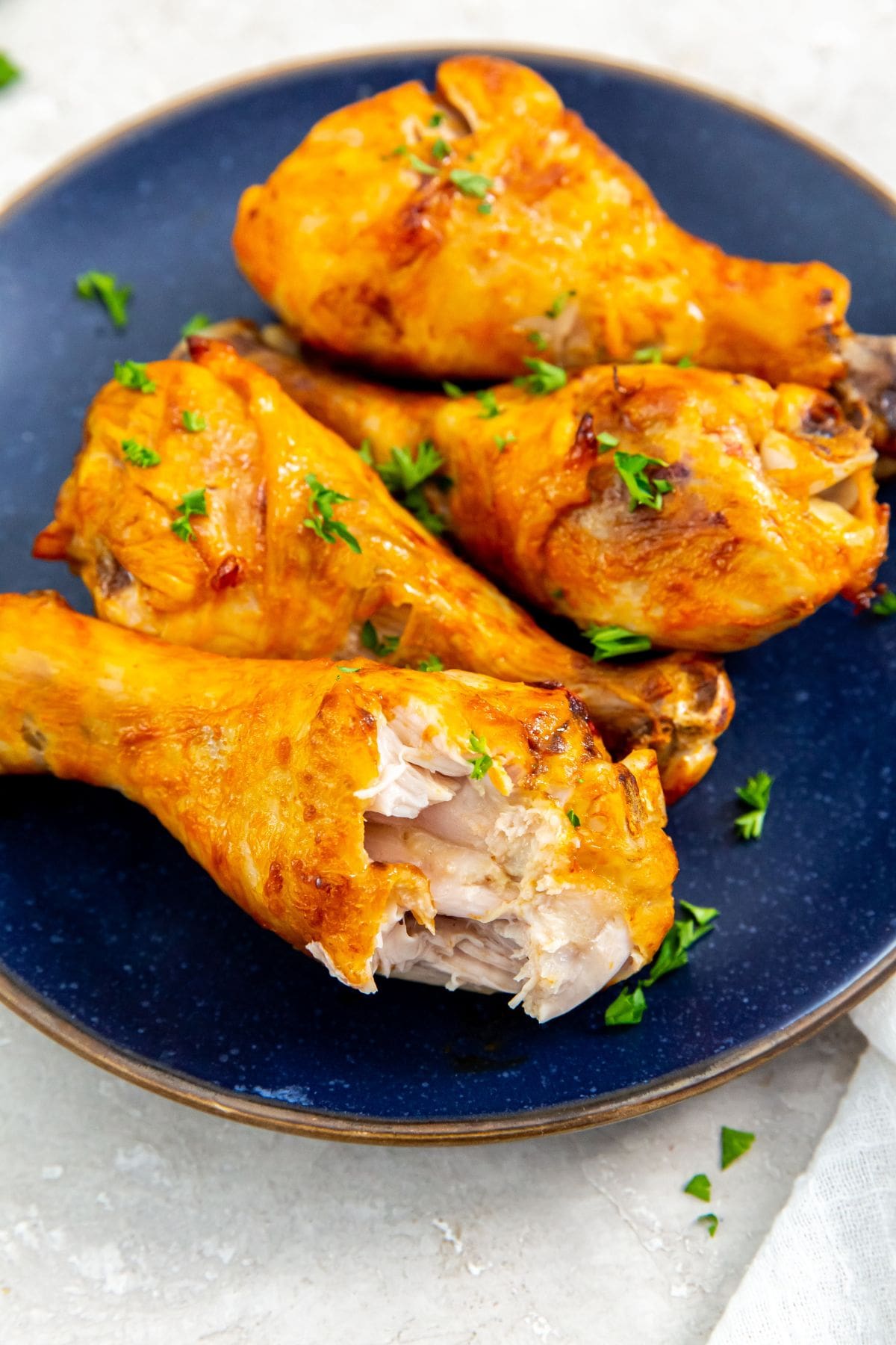 Air Fryer Buffalo Chicken Legs blue plate with chicken on it.