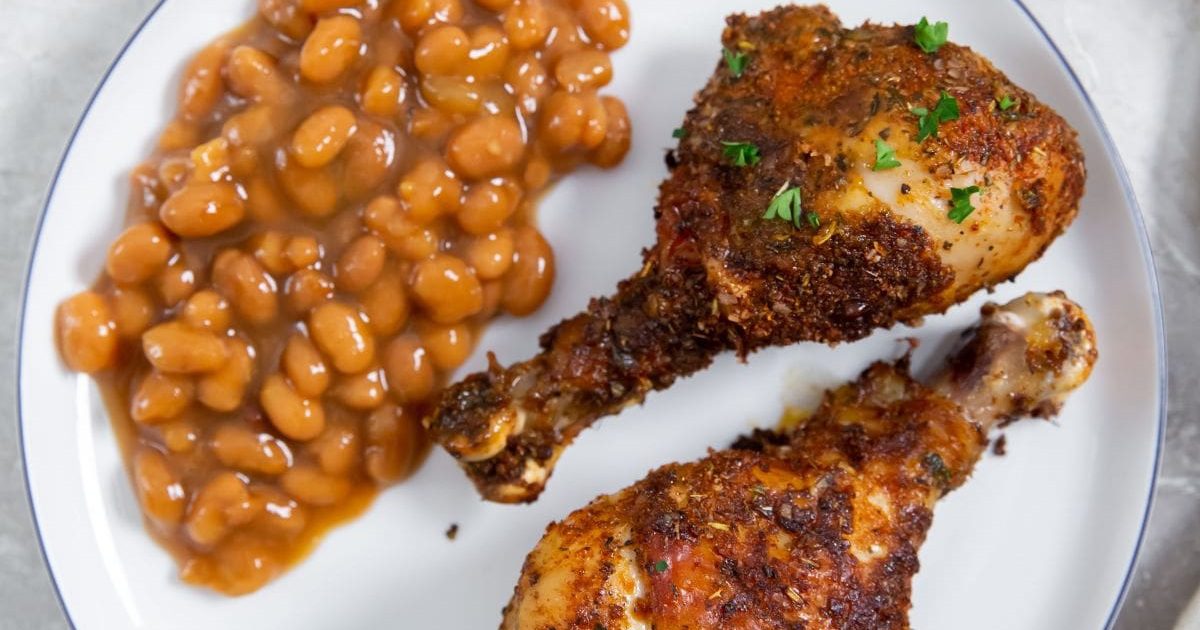 Dinner Ideas for Two Air Fryer Chicken Legs with Dry Rub with Baked Beans on a White Plate