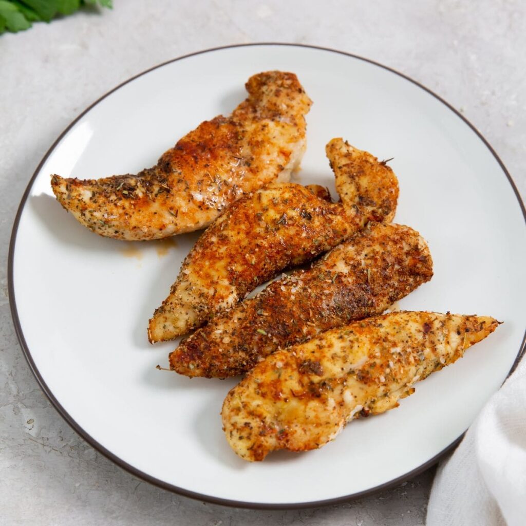 Air Fryer Blackened Chicken Tenders on a White Plate