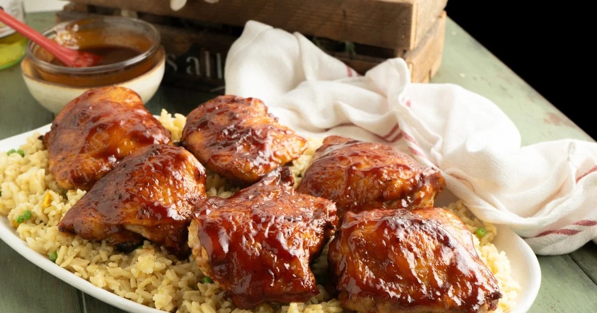 Air Fryer Bone-In Chicken Thigh Recipes Air Fryer BBQ Chicken Thighs on Rice on a Serving Platter