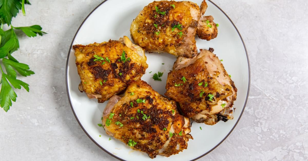 Air Fryer Bone-In Chicken Thigh Recipes Easy Air Fryer Keto Chicken Thighs on a White Plate