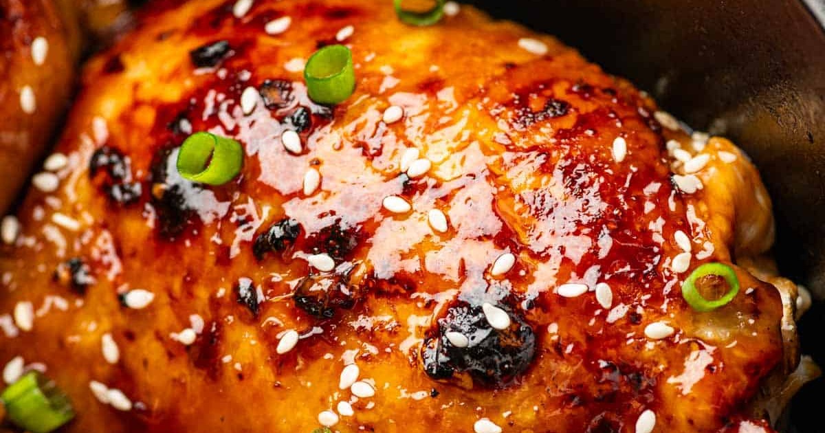 Air Fryer Bone-In Chicken Thigh Recipes Close Up of Air Fryer Teriyaki Chicken Thighs Garnished with Diced Green Onions