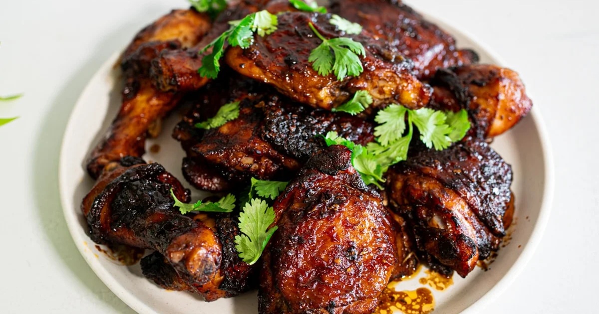 Air Fryer Bone-In Chicken Thigh Recipes a Pile of Best Asian Air Fryer Bone-In Chicken Thighs on a Plate