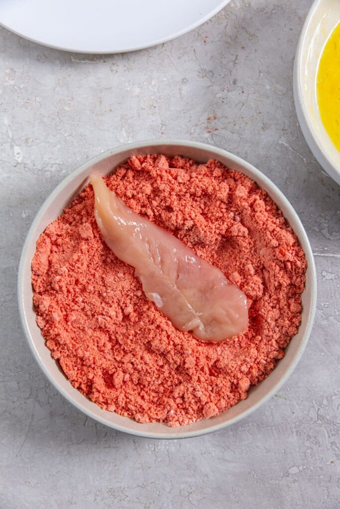 Air Fryer Flamin' Hot Cheetos Chicken Tenders chicken inside Cheeto crumbs