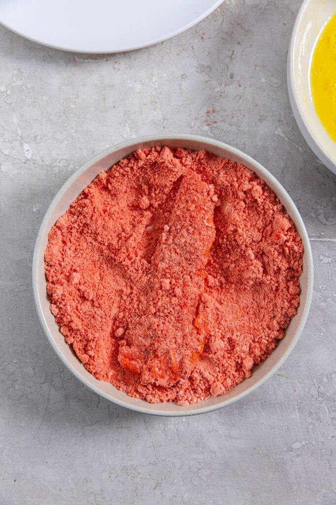 Air Fryer Flamin' Hot Cheetos Chicken Tenders chicken inside Cheeto crumbs