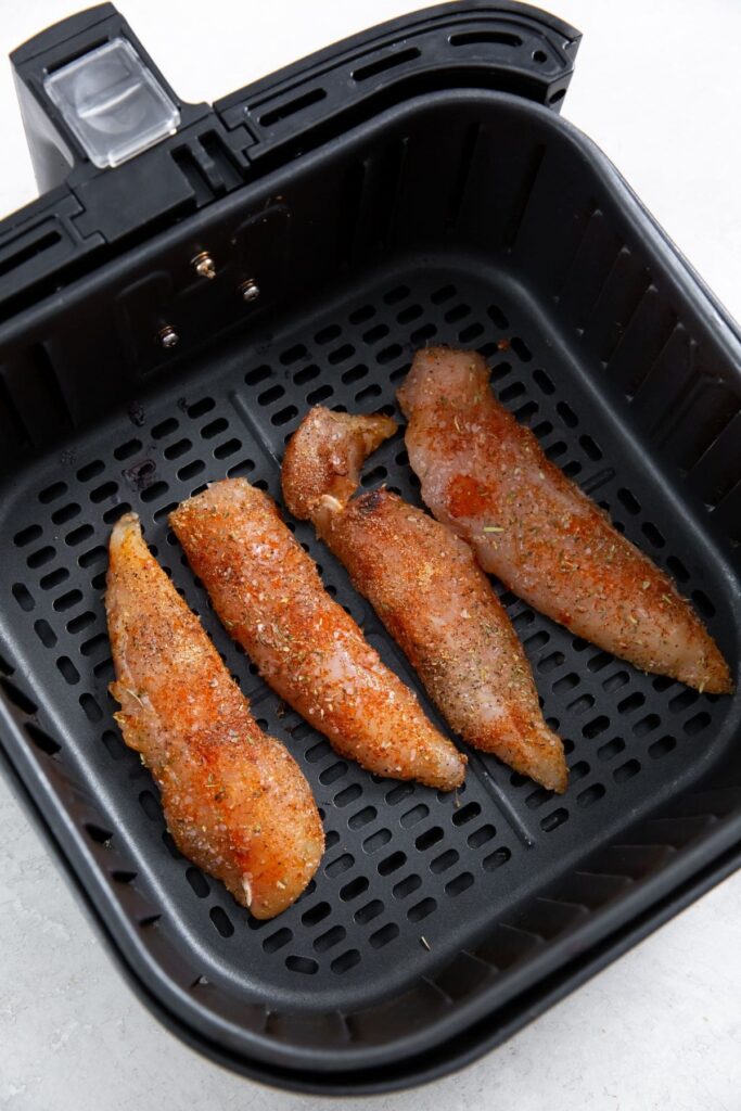 Air Fryer Blackened Chicken Tenders black air fryer with race chicken